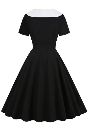 Vestido swing negro de la década de 1950 con cinturón